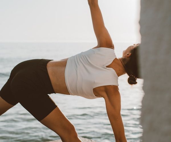 Close-up of a person taking a deep, calm breath outdoors.